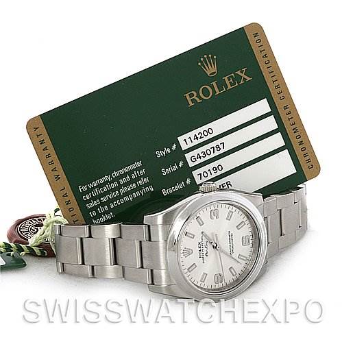 The image shows a Rolex Air-King 114200SASO Men's Stainless Steel Silver Dial 114200SASO Men's Stainless Steel Silver Dial watch displayed at a 3/4 angle, along with its green certification card.
