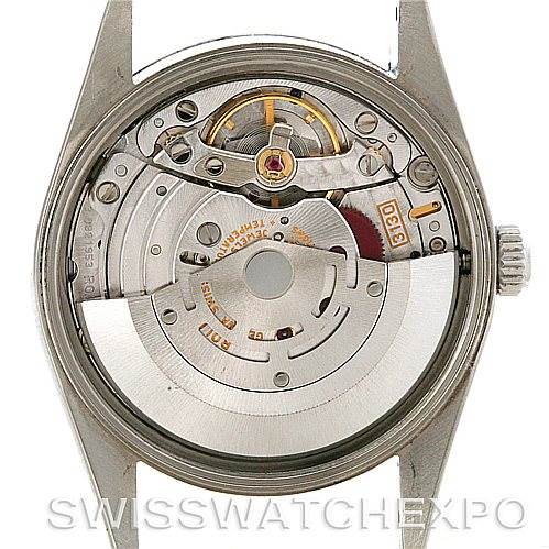 The image shows the inner mechanism of a Rolex Air-King 14000 M Men's Stainless Steel Silver Dial 14000 M Men's Stainless Steel Silver Dial watch, featuring the movement and rotor.