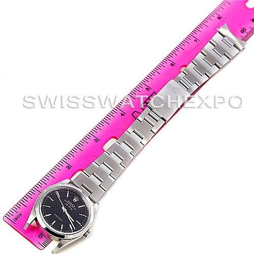 The image shows a Rolex Air-King 14000 Men's Stainless Steel Black Dial 14000 Men's Stainless Steel Black Dial watch laid flat next to a pink ruler, displaying the face, bracelet, and clasp.