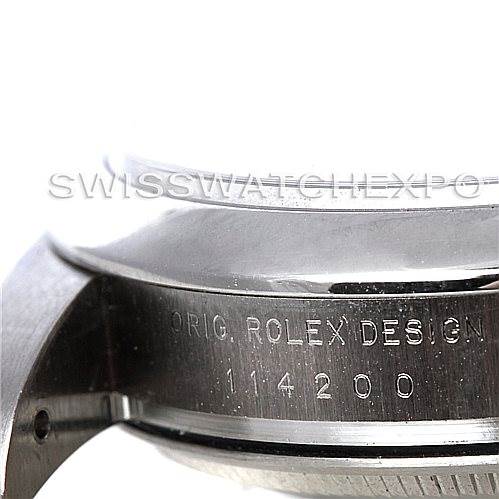The image shows a close-up of the side of a Rolex Air-King 114200 Men's Stainless Steel Blue Dial 114200 Men's Stainless Steel Blue Dial watch case, featuring the "ORIG. ROLEX DESIGN" and model number 114200.