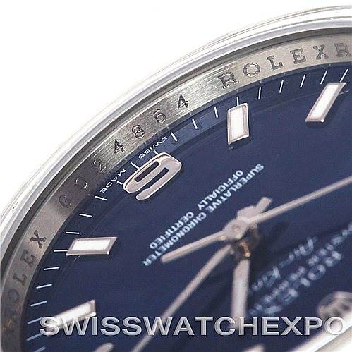 This image shows a detailed close-up of the dial and bezel of a Rolex Air-King 114200 Men's Stainless Steel Blue Dial 114200 Men's Stainless Steel Blue Dial watch, focusing on the hour markers and surrounding text.