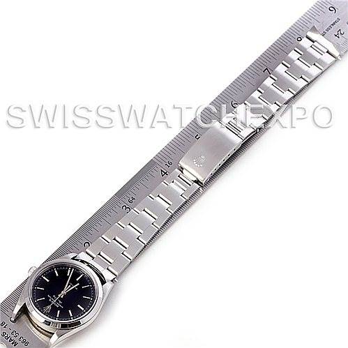 The image shows the Rolex Air-King 14000 Men's Stainless Steel Black Dial 14000 Men's Stainless Steel Black Dial watch laid flat on a ruler, displaying the dial, bracelet, and clasp.