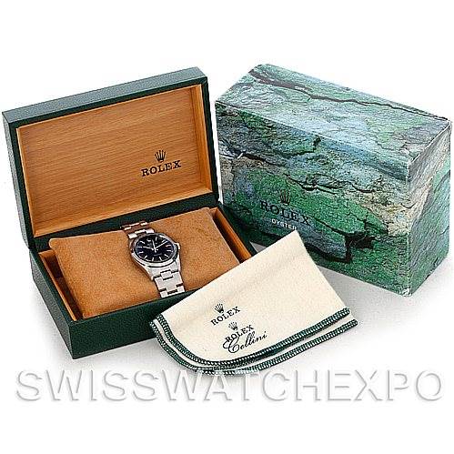 The image shows a Rolex Air-King 14000 Men's Stainless Steel Black Dial 14000 Men's Stainless Steel Black Dial watch angled inside its open box with a cleaning cloth and outer packaging nearby.