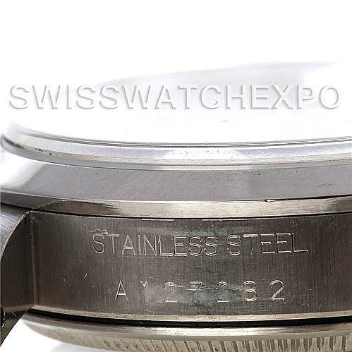 The image shows a side angle of the Rolex Air-King 14000 Men's Stainless Steel Black Dial 14000 Men's Stainless Steel Black Dial watch, focusing on the stainless steel casing and engraved serial number.