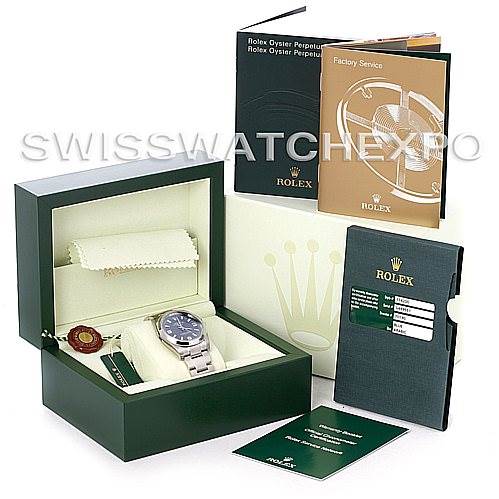 The image shows a Rolex Air-King 114200 Men's Stainless Steel Blue Dial 114200 Men's Stainless Steel Blue Dial watch in its box along with booklets, tags, and other accessories.