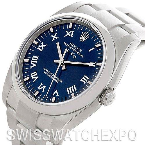This image shows a Rolex Air-King 114200 Men's Stainless Steel Blue Dial 114200 Men's Stainless Steel Blue Dial watch from an angled view, highlighting its blue dial, Roman numerals, and stainless steel bracelet.