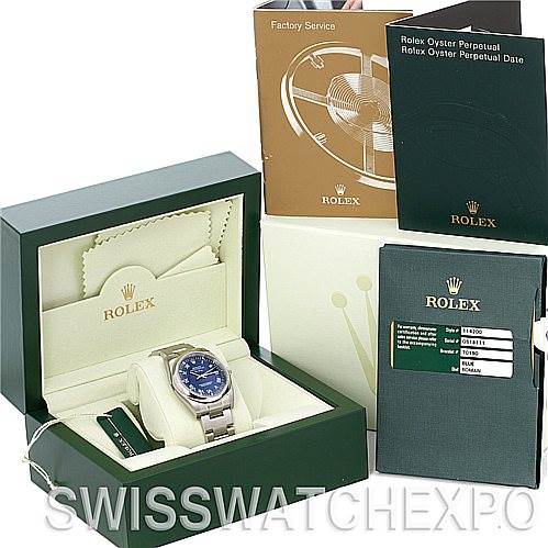 The image shows a Rolex Air-King 114200 Men's Stainless Steel Blue Dial 114200 Men's Stainless Steel Blue Dial watch at an angle, inside its box, along with manuals and warranty card placed beside the box.