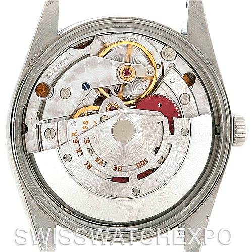 This image shows the open back of a Rolex Air-King 14000 Men's Stainless Steel Silver Dial 14000 Men's Stainless Steel Silver Dial watch, revealing its internal mechanical movement parts.