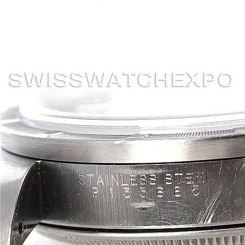 The image shows a close-up side view of a Rolex Air-King 14010 Men's Stainless Steel White Dial 14010 Men's Stainless Steel White Dial watch, focusing on the stainless steel bezel and case with engraved serial numbers.