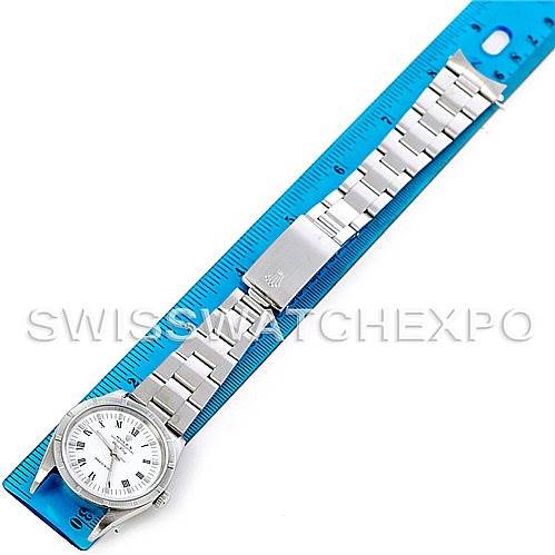 The image shows a top-down view of a Rolex Air-King 14010 Men's Stainless Steel White Dial 14010 Men's Stainless Steel White Dial watch laid next to a blue ruler.