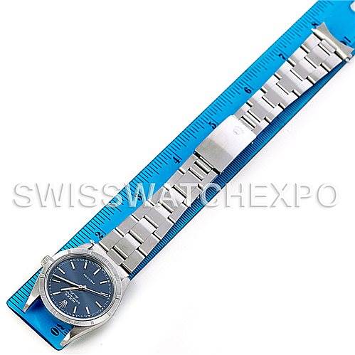 This image shows a top-down view of the Rolex Air-King 14010 Men's Stainless Steel Blue Dial 14010 Men's Stainless Steel Blue Dial watch, displaying the watch face, case, and the full length of the metal bracelet laid out next to a ruler.