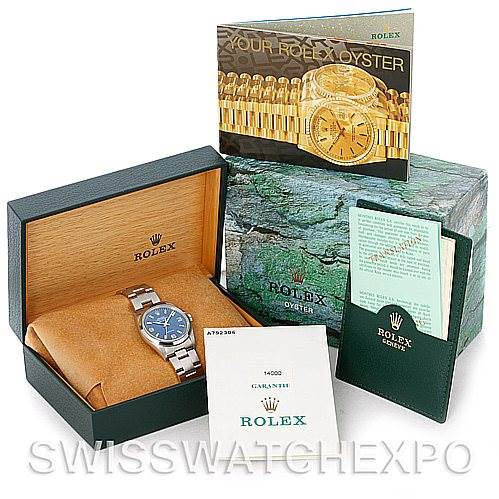 The image shows the Rolex Air-King 14000 Men's Stainless Steel Blue Dial 14000 Men's Stainless Steel Blue Dial watch in its box, along with booklets, paperwork, and the outer packaging.