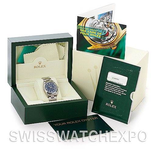 This image shows a Rolex Air-King 14000 Men's Stainless Steel Blue Dial 14000 Men's Stainless Steel Blue Dial watch in its box, along with documents, a pamphlet, and a cleaning cloth.
