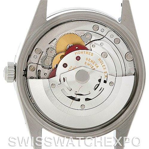 This image of a Rolex Air-King 14010 Men's Stainless Steel Black Dial 14010 Men's Stainless Steel Black Dial watch shows the internal mechanism from the back case, highlighting gears and the movement.