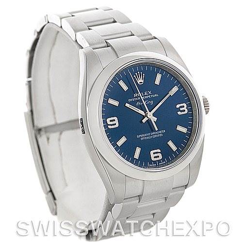 The image shows a side-angled view of a Rolex Air-King 114200 Men's Stainless Steel Blue Dial 114200 Men's Stainless Steel Blue Dial watch, highlighting the blue dial, crown, and stainless steel bracelet.
