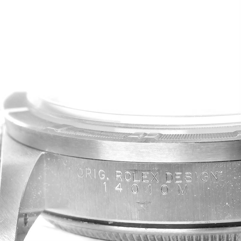 The image shows a close-up of the case side of a Rolex Air-King 14010 Men's Stainless Steel Blue Dial 14010 Men's Stainless Steel Blue Dial watch, revealing the engravings "ORIG. ROLEX DESIGN" and the model number "14010M."