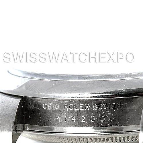 This image shows a close-up view of the side of a Rolex Air-King 114200 Men's Stainless Steel Blue Dial 114200 Men's Stainless Steel Blue Dial watch case, displaying the "Orig. Rolex Design" engraving and model number 114200.