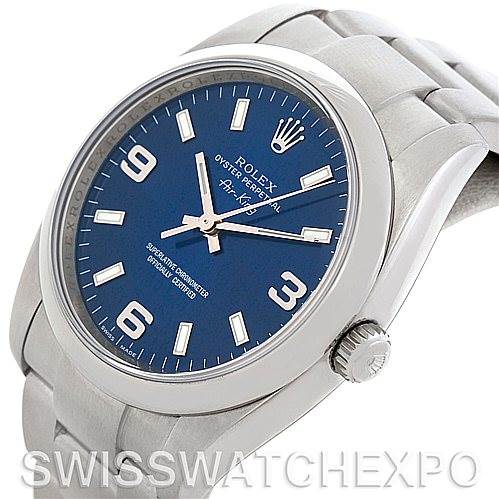 The image shows a close-up of a Rolex Air-King 114200 Men's Stainless Steel Blue Dial 114200 Men's Stainless Steel Blue Dial watch from an angled view, displaying the dial, crown, and part of the bracelet.