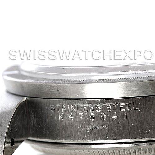 The image shows a close-up of the side of a Rolex Air-King 14010 Men's Stainless Steel Silver Dial 14010 Men's Stainless Steel Silver Dial watch case, featuring the stainless steel engraving and serial number.
