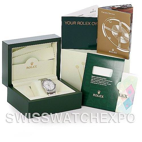 The image shows a Rolex Air-King 114210 Men's Stainless Steel Silver Dial 114210 Men's Stainless Steel Silver Dial watch in its open box, with accompanying manuals and booklets displayed around it.