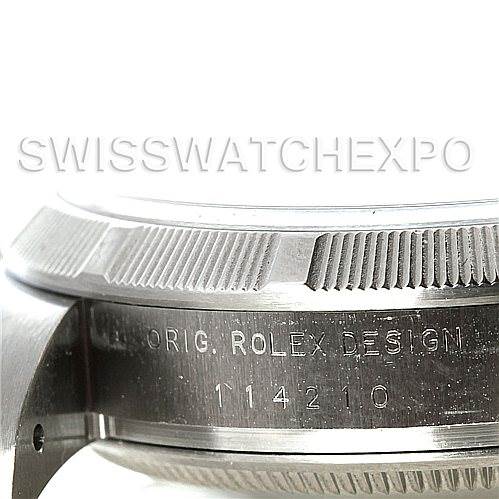 This image shows a close-up side view of the case of a Rolex Air-King 114210 Men's Stainless Steel Silver Dial 114210 Men's Stainless Steel Silver Dial watch, highlighting the bezel and engraved text.