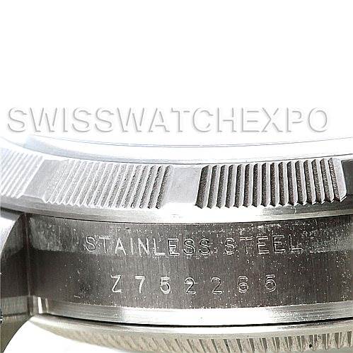 The image shows a close-up angle of the stainless steel case and bezel of a Rolex Air-King 114210 Men's Stainless Steel Silver Dial 114210 Men's Stainless Steel Silver Dial watch, displaying the serial number.