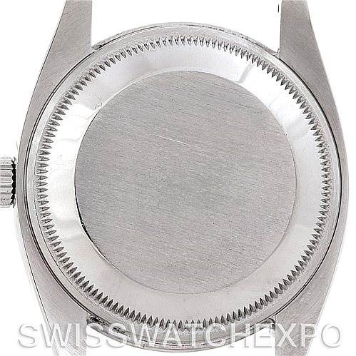 This image shows the back case of a Rolex Air-King 114210 Men's Stainless Steel Silver Dial 114210 Men's Stainless Steel Silver Dial watch, viewed from a top-down angle.