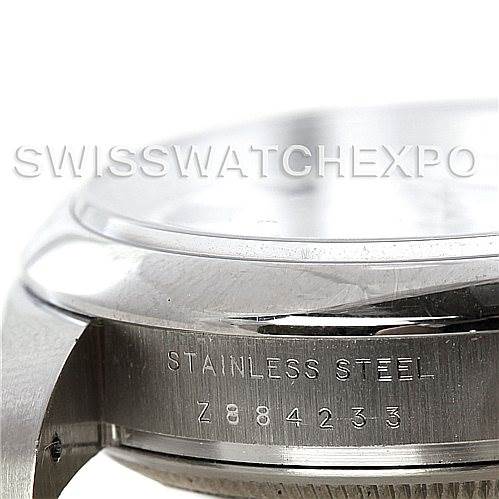 The image shows a close-up, angled view of the stainless steel case and serial number of a Rolex Air-King 114200 Men's Stainless Steel White Dial 114200 Men's Stainless Steel White Dial watch.