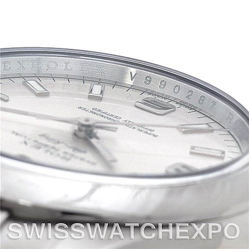 The image shows a close-up, angled view of the Rolex Air-King 114200 Men's Stainless Steel Silver Dial 114200 Men's Stainless Steel Silver Dial watch's dial, ref, and bezel.