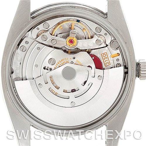 The image shows the back view of the internal mechanism of a Rolex Air-King 114200 Men's Stainless Steel Silver Dial 114200 Men's Stainless Steel Silver Dial watch, highlighting its intricate components.