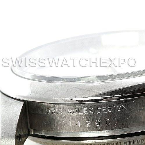 This image shows a close-up angle of the case side and bezel of a Rolex Air-King 114200 Men's Stainless Steel Silver Dial 114200 Men's Stainless Steel Silver Dial watch, highlighting the engraved serial number and "Rolex Design."