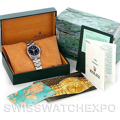 The image shows a Rolex Air-King 14010 Men's Stainless Steel Black Dial 14010 Men's Stainless Steel Black Dial watch at a slightly elevated angle with its box, manuals, and cards beside it.