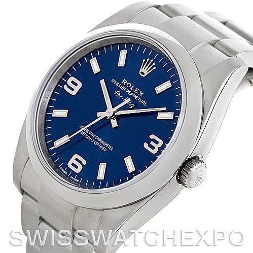 The image shows a Rolex Air-King 114200 Men's Stainless Steel Blue Dial 114200 Men's Stainless Steel Blue Dial watch from an angled view, featuring its face, crown, and part of its bracelet.