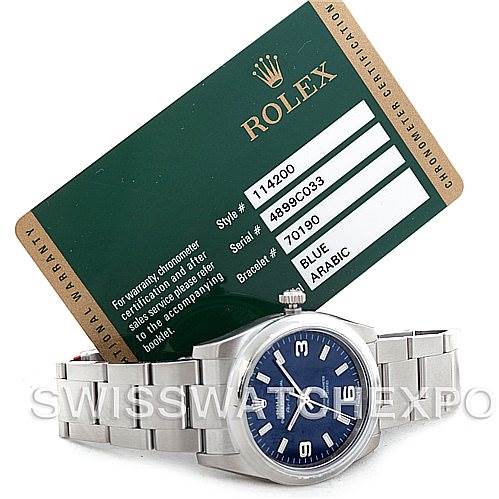 The image shows a Rolex Air-King 114200 Men's Stainless Steel Blue Dial 114200 Men's Stainless Steel Blue Dial watch in a front angle, accompanied by its official certification card.