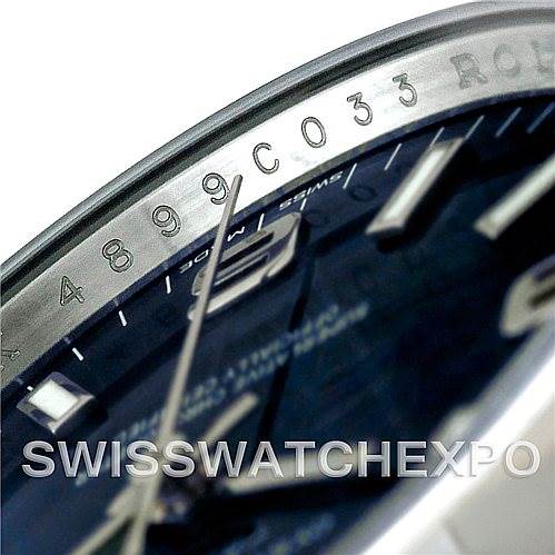 The image shows a close-up of the dial and the side of a Rolex Air-King 114200 Men's Stainless Steel Blue Dial 114200 Men's Stainless Steel Blue Dial watch, highlighting the engraved serial number and part of the bezel.