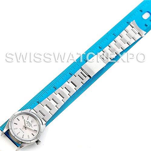 The image shows a Rolex Air-King 14010 Men's Stainless Steel Silver Dial 14010 Men's Stainless Steel Silver Dial watch laid flat against a blue ruler, displaying its face and full metal bracelet.