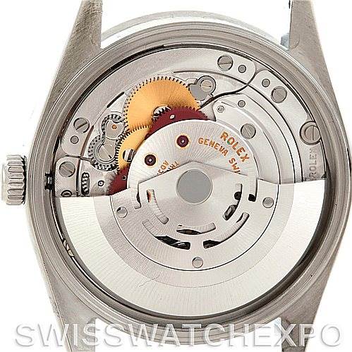 The image shows the rear view of a Rolex Air-King 14010 Men's Stainless Steel White Dial 14010 Men's Stainless Steel White Dial watch, revealing its intricate mechanical movement and internal components.
