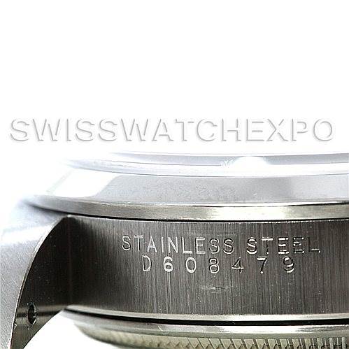 This image shows a close-up view of the stainless steel side of the bezel and case of a Rolex Air-King 14000 Men's Stainless Steel Pink Dial 14000 Men's Stainless Steel Pink Dial watch, including its serial number.