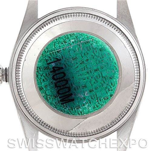 This image shows the back case of a Rolex Air-King 14000 Men's Stainless Steel Pink Dial 14000 Men's Stainless Steel Pink Dial watch from a top-down angle, highlighting the serial number sticker.