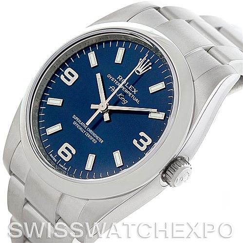 The Rolex Air-King 114200 Men's Stainless Steel Blue Dial 114200 Men's Stainless Steel Blue Dial watch is displayed at an angle showing its face, bezel, crown, and part of the bracelet.