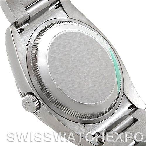 The image shows the back case, crown, and part of the bracelet clasp of a Rolex Air-King 114200 Men's Stainless Steel Blue Dial 114200 Men's Stainless Steel Blue Dial watch from an angled perspective.