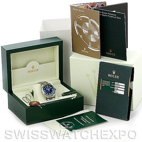 The image shows an Air-King Rolex watch in an open box, along with manuals, a tag, and a cleaning cloth.