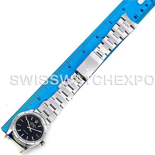 The image shows a top-down view of a Rolex Air-King 14010 Men's Stainless Steel Black Dial 14010 Men's Stainless Steel Black Dial watch, focusing on the face, bracelet, and clasp against a ruler for scale.