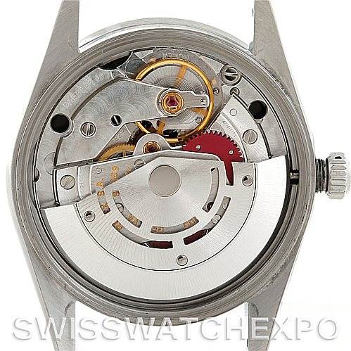 The image shows the back view of a Rolex Air-King 14010 Men's Stainless Steel Black Dial 14010 Men's Stainless Steel Black Dial watch, revealing its internal mechanical movement and parts.