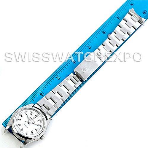 The Rolex Air-King 14000 Men's Stainless Steel White Dial 14000 Men's Stainless Steel White Dial watch is shown diagonally with a blue ruler beside it, displaying the watch face and metal bracelet.