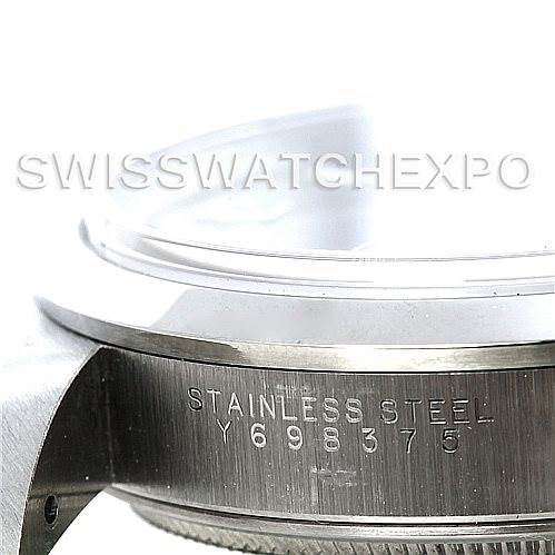 The image shows a close-up side view of a stainless steel case from a Rolex Air-King 14000 Men's Stainless Steel Blue Dial 14000 Men's Stainless Steel Blue Dial model with the serial number engraved.