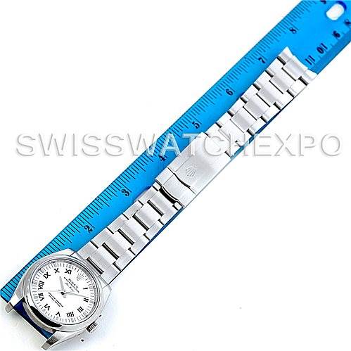 The Rolex Air-King 114200 Men's Stainless Steel White Dial 114200 Men's Stainless Steel White Dial watch is shown from a top-down angle, displaying the face and full bracelet against a blue ruler for scale.