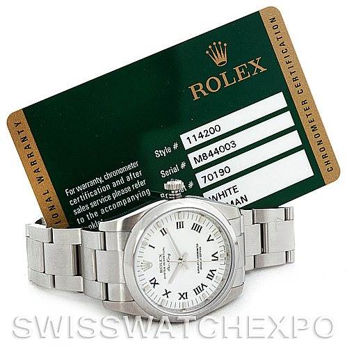 This image shows a Rolex Air-King 114200 Men's Stainless Steel White Dial 114200 Men's Stainless Steel White Dial watch and its warranty card from a front angle.
