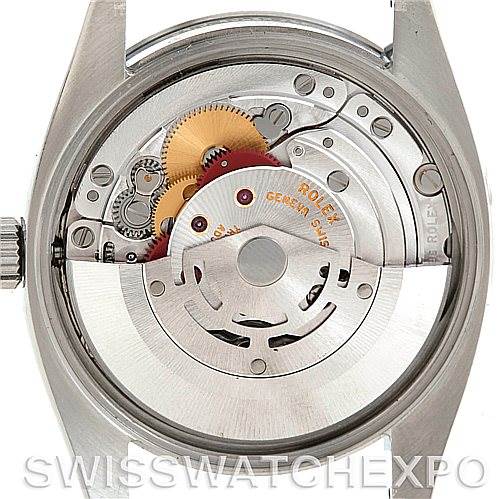 This image shows the interior mechanism of a Rolex Air-King 114200 Men's Stainless Steel White Dial 114200 Men's Stainless Steel White Dial watch from the back, revealing its gears and movement components.