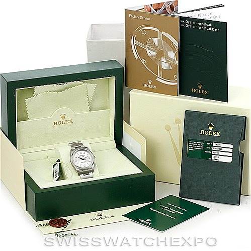 The image shows a Rolex Air-King 114200 Men's Stainless Steel Silver Dial 114200 Men's Stainless Steel Silver Dial watch in a green box, with included manuals and original packaging displayed around it.